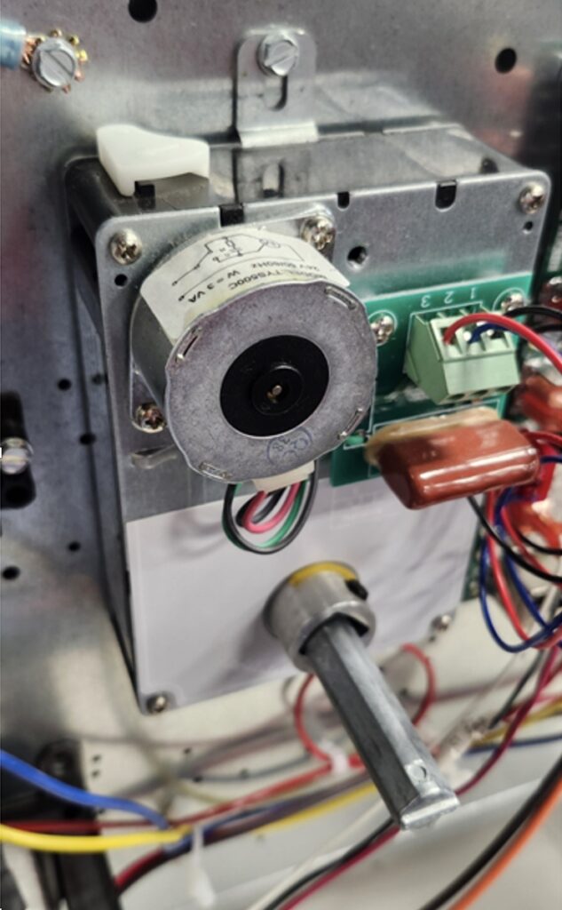 Role of VAV in Commercial Buildings: How It Works and Why It Matters VAV box interior showing damper and actuator in commercial HVAC system